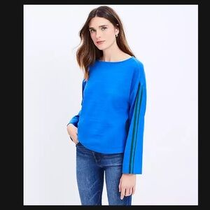 Loft blue top with green ribbon trim